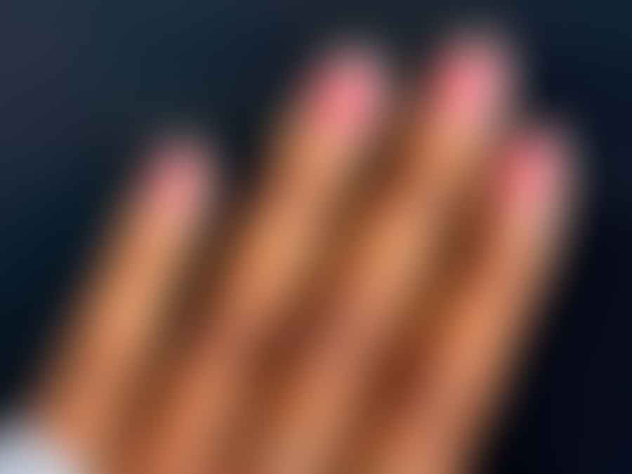 Elegant almond shaped nails on a narrow hand