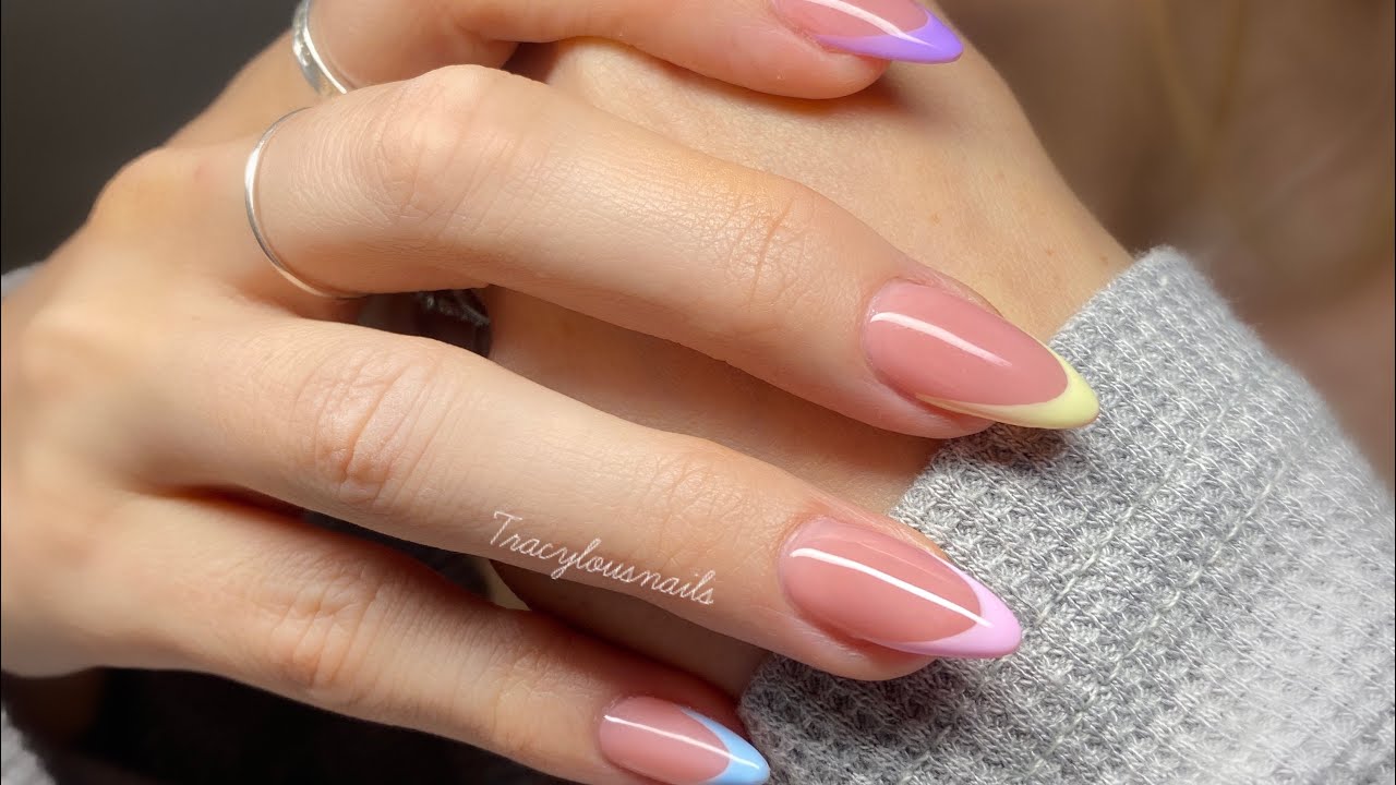 Colorful French manicure on almond-shaped nails